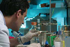Photo of a scientist in the lab. Link to Gifts by Will.
