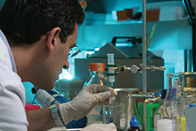 Photo of a man working in Lab. Link to Shirley Fredson's story.