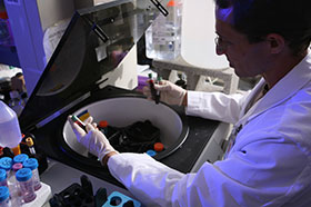 Photo of a scientist in the lab. Link to Gifts That Protect Your Assets.